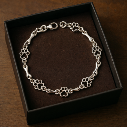 Pulsera con dijes de pata de perro y hueso en plata