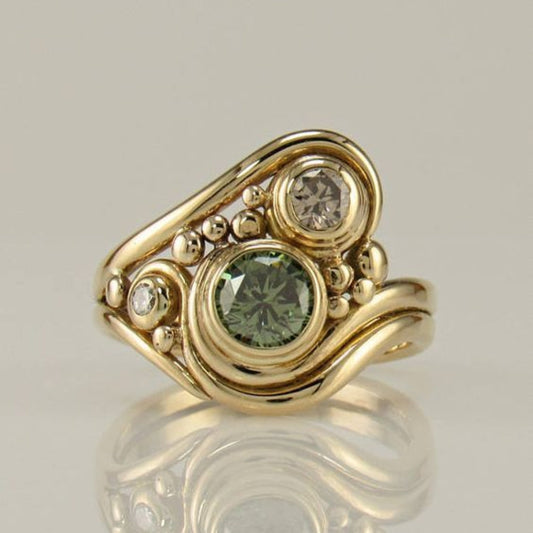 Anillo vintage en circonita verde dorada 