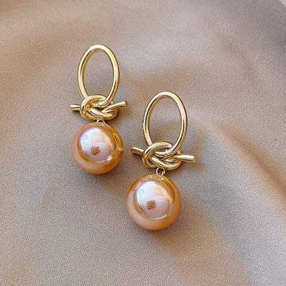 Pendientes de aro con perlas doradas