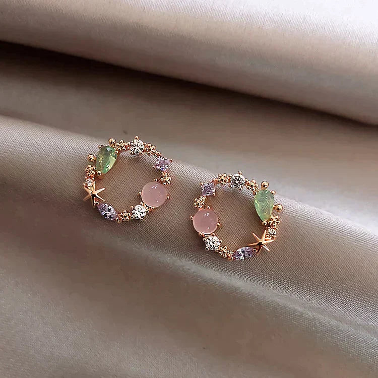 Pendientes florales de cristal en oro rosa