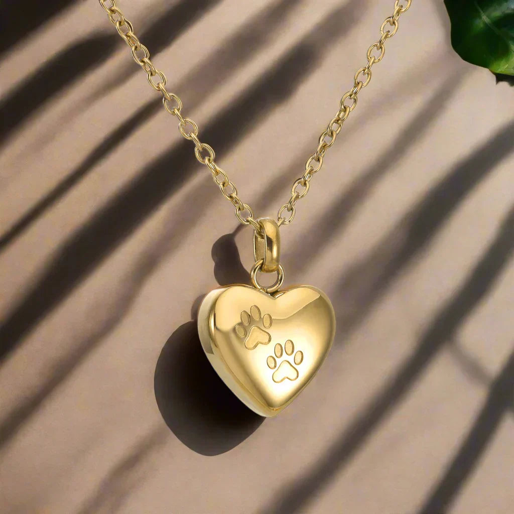 Collar con urna conmemorativa para mascotas: colgante en forma de corazón con huella de pata grabada
