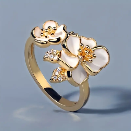 Anillo de oro con flor blanca 