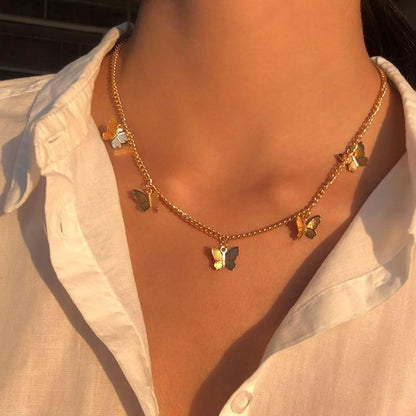 Collar de mariposa bañado en plata y oro